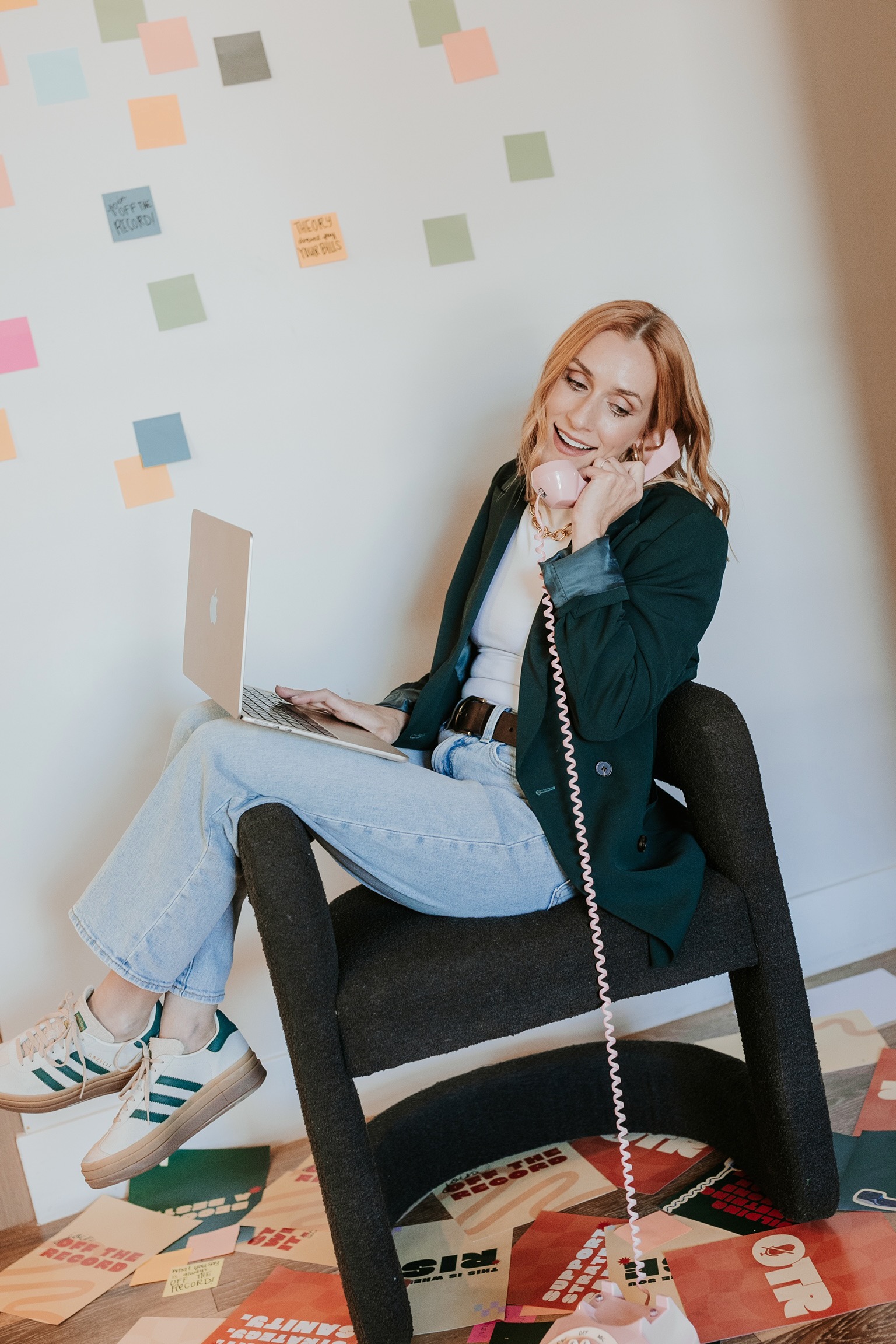 Gab Ferree on an orange retro telephone